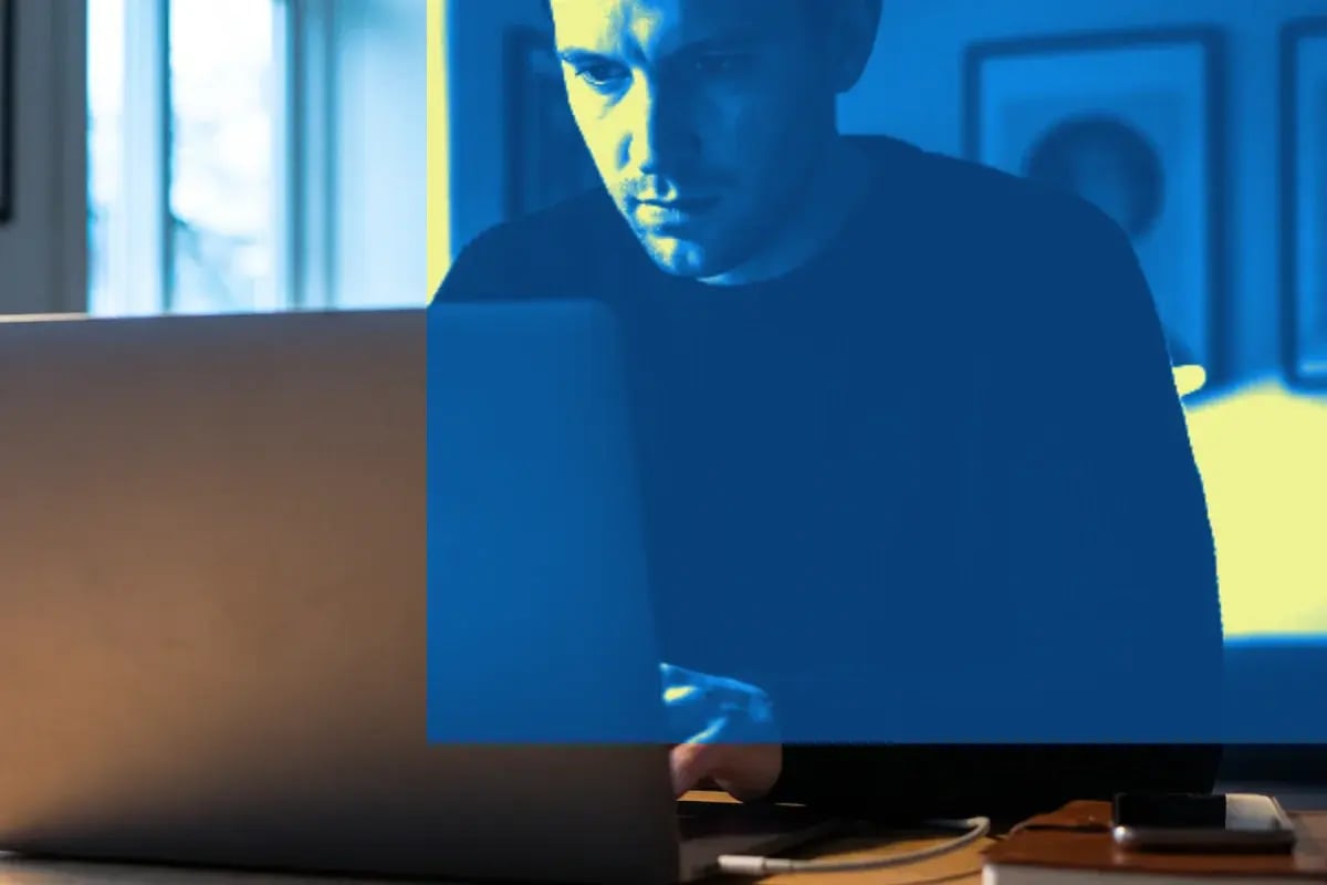 Remote worker signing in on a laptop