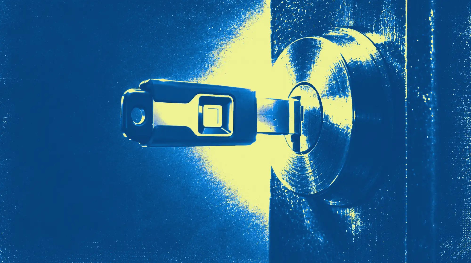 Hardware security key inserted into a door lock like a house key